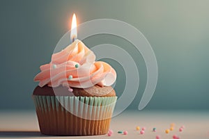 Chocolate cupcake with birthday candle, pink frosting and sugar sprinkles. Generative AI