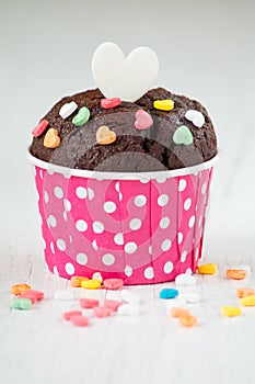 Chocolate cupcake with heart candy