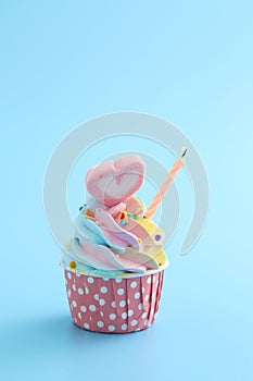 Chocolate cupcake isolated in blue background