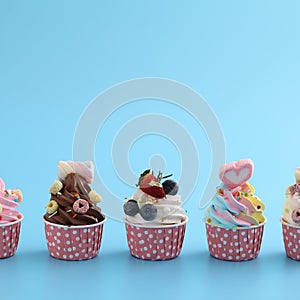 Chocolate cupcake isolated in blue background