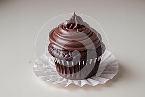 Chocolate Cupcake With Swirled Frosting on a White Table