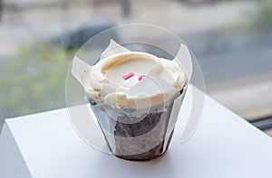 chocolate cupcake with a vanilla buttercream frosting