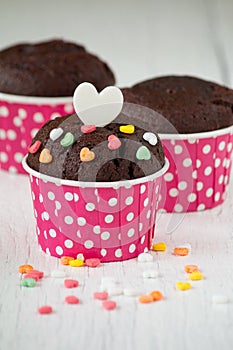 Chocolate cupcake on white wooden table