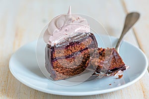 Chocolate cupcakes with berry confit and Swiss meringue.