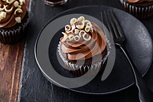 Chocolate cupcakes with dark chocolate ganashe frosting