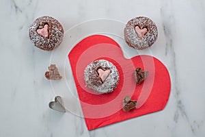 Chocolate Cupcakes decorated with sugar hearts for Valentine`s Day