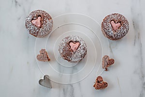 Chocolate Cupcakes decorated with sugar hearts for Valentine \'s Day