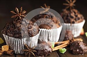 Chocolate cupcakes with filling, sweets on the table