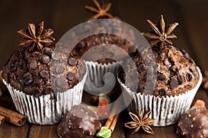 Chocolate cupcakes with filling, sweets on the table