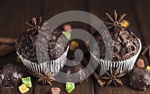 Chocolate cupcakes with filling, sweets on the table