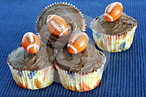 Chocolate cupcakes with footballs