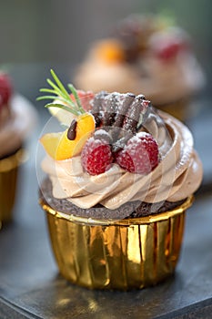 Chocolate cupcakes with fruits. A beautiful dessert.