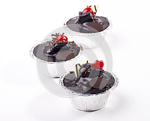 Chocolate cupcakes isolated on white background