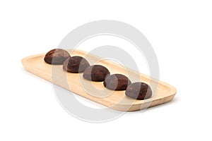 Chocolate daifuku on wooden plate