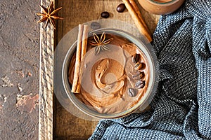 Chocolate dessert with coffee and spices in a wooden tray. Rustic style. Spicy chocolate and coffee mousse