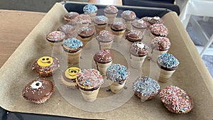 Chocolate dipped cupcakes with sprinkles