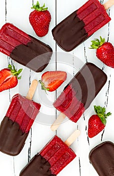 Chocolate dipped strawberry red wine popsicles.