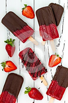 Chocolate dipped strawberry red wine popsicles.