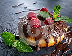 chocolate donut and fresh raspberries