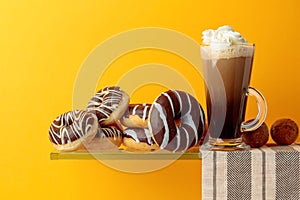 Chocolate donuts and coffee cocktail with cream