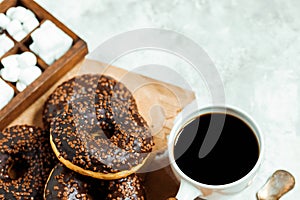 Chocolate donuts and coffee , weekend morning table breakfast. Vintage colors.