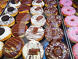 Chocolate donuts and fruit icing