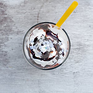 Chocolate drink with stras and yellow straw photo