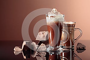 Chocolate drinks with whipped cream and pieces of dark chocolate