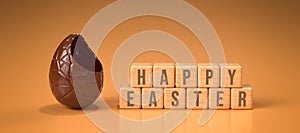 Chocolate easter egg with cubes and the message HAPPY EASTER - 3d rendered illustration