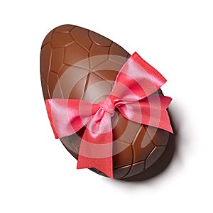 Chocolate Easter egg with pink ribbon bow