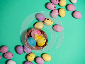 Chocolate easter eggs green background
