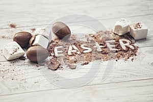 Chocolate Easter eggs with marshmallow and cocoa that says Easter
