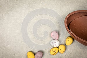 Chocolate Easter eggs on plain background with space for easter message