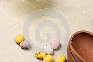 Chocolate Easter eggs on plain background with space for easter message