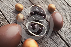 Chocolate easter eggs on wooden background