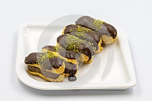 Chocolate eclair cake isolated on white background