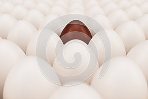 Chocolate egg in a centre. Background of white chicken eggs with one chocolate egg. Symbol of easter, holidays. 3D
