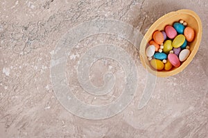 Chocolate egg for Easter on wooden background