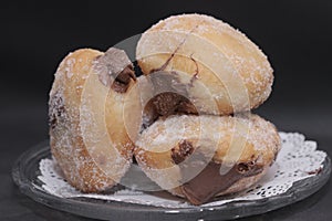 Chocolate filled doughnuts with fine sugar toppings