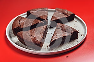 Chocolate Flourless Cake on red background. Soft chocolate gÃ¢teau