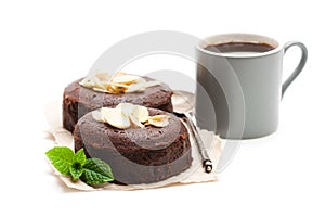 Chocolate fondant with almonds and cup of coffee isolated on wh