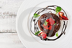 Chocolate fondant cupcake with strawberries