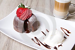 Chocolate fondant lava cake with strawberries and ice cream