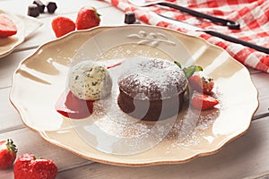 Chocolate fondant with vanilla ice cream and strawberry