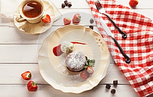 Chocolate fondant with vanilla ice cream and strawberry