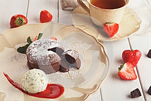 Chocolate fondant with vanilla ice cream and strawberry