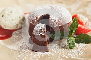 Chocolate fondant with vanilla ice cream and strawberry