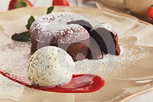 Chocolate fondant with vanilla ice cream and strawberry