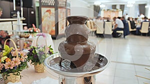 Chocolate fountain at a wedding celebration.