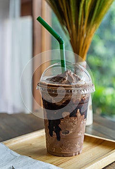 Chocolate frappe on table in cafe photo